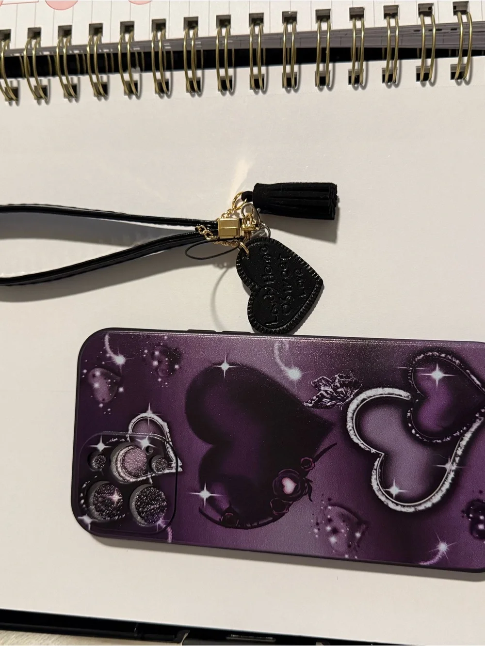 Purple Heart Pattern Phone Case with Wrist Strap for Apple 16 pro max.